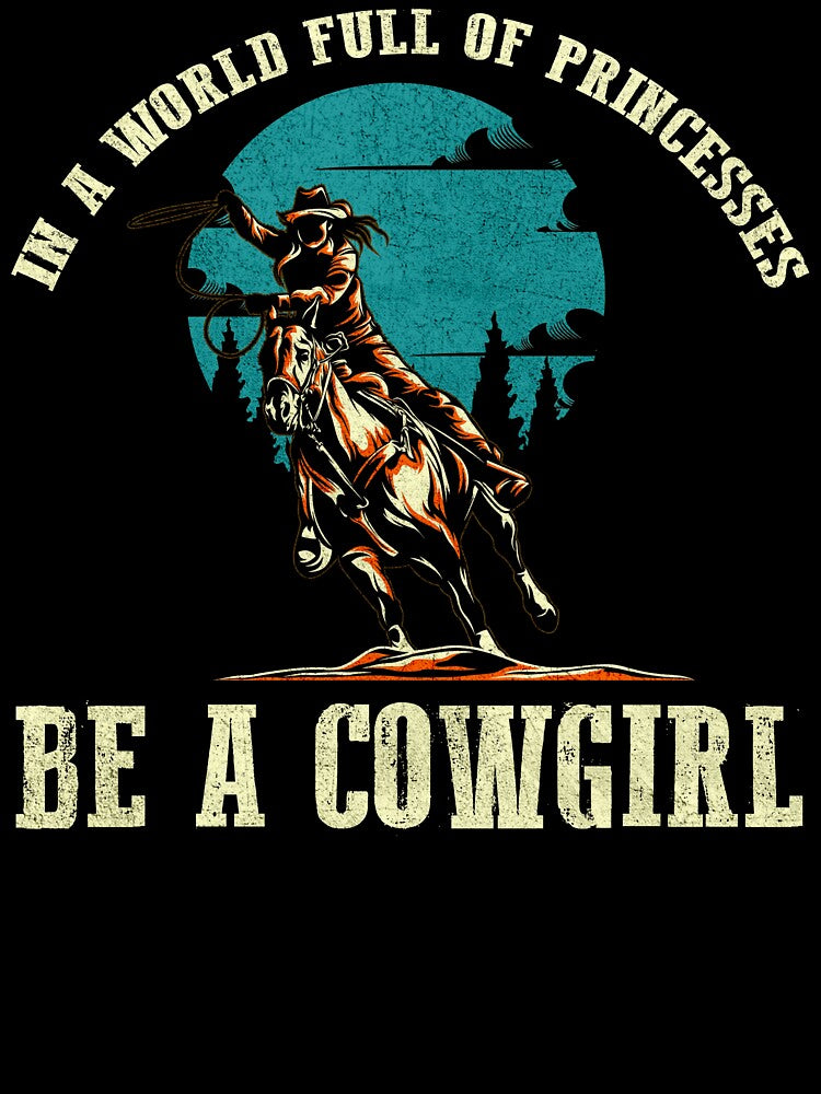 In A World Full Of Princesses Be A Cowgirl T-Shirt by Macabretees