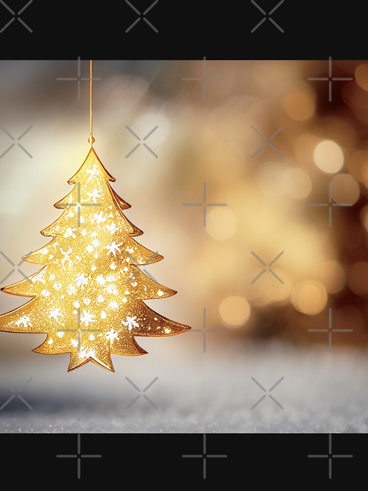 a golden christmas tree ornament hanging from a string by DesignAtYO