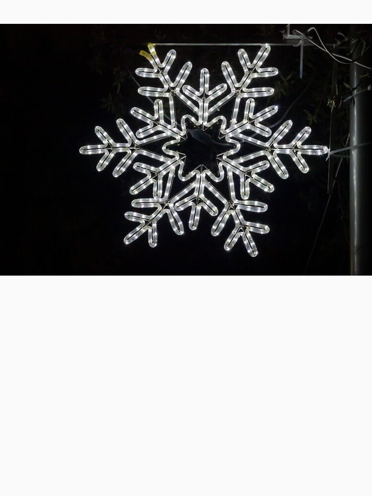 Illuminated Snowflake Holiday Light Decoration Hanging On Pole Against Dark Night Sky by Nmallia