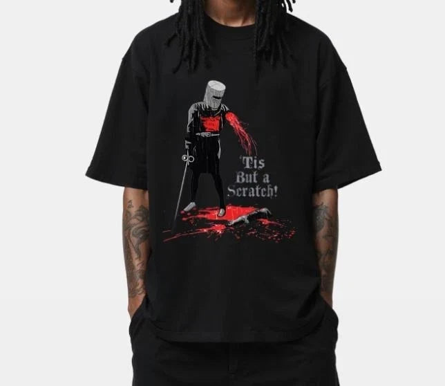 Tis But a Scratch – Funny Medieval Knight Graphic Tee for Humor Fans Unisex